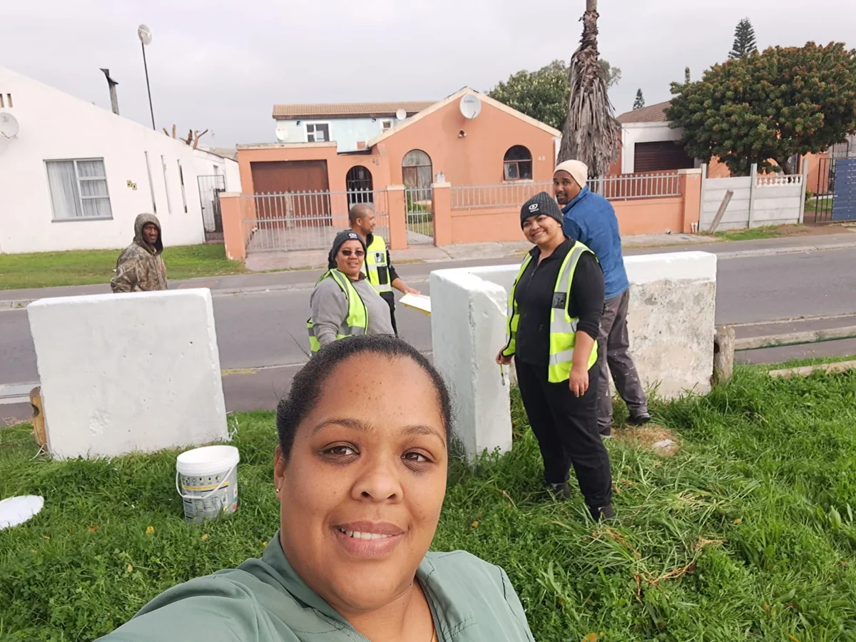 Community participants gathered outdoors during neighbourhood activity.